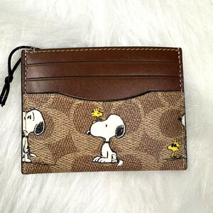 Coach X Peanuts Slim Id Card Case In Signature Canvas With Snoopy Print CBK55